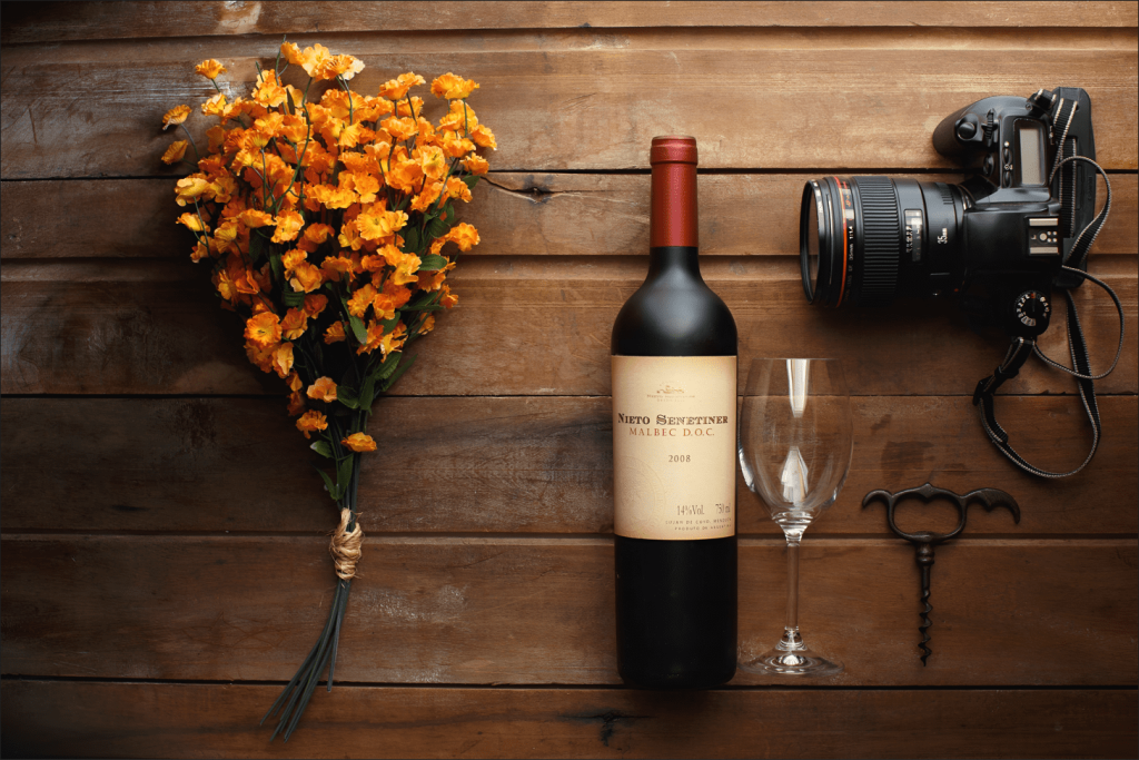 Bottle of Malbec, Bouquet of Flowers, Wine Glass, Wine Opener, and Professional Camera